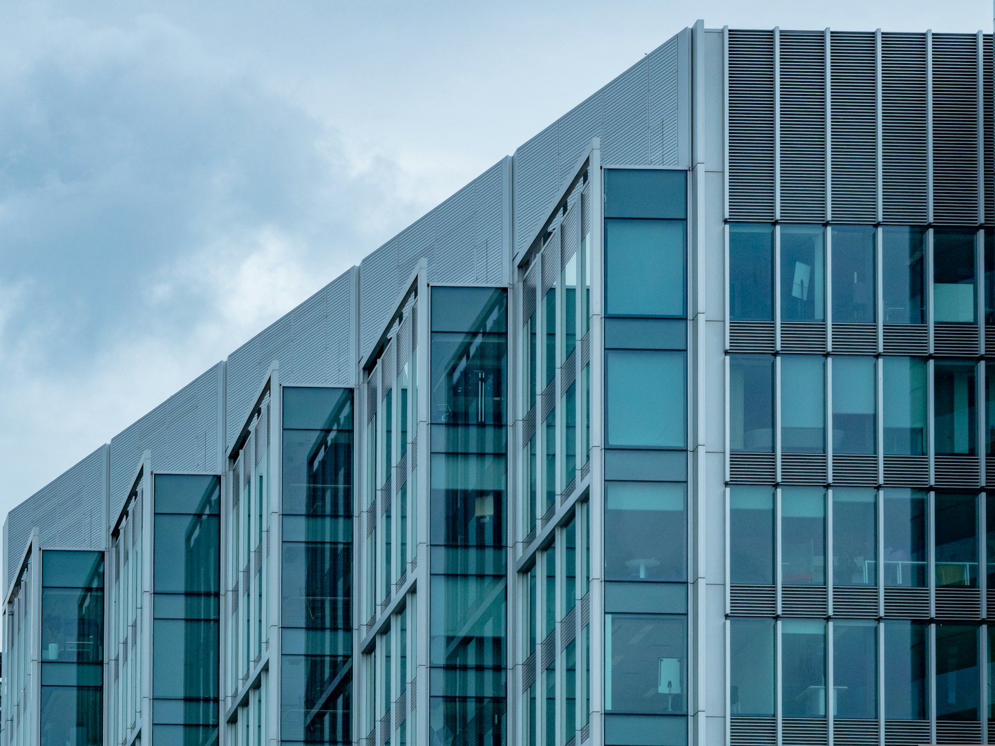 Modern office building with glass and metal facade.